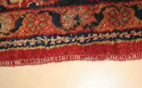 avant réparation de la lisière pour un tapis d'orient persan
