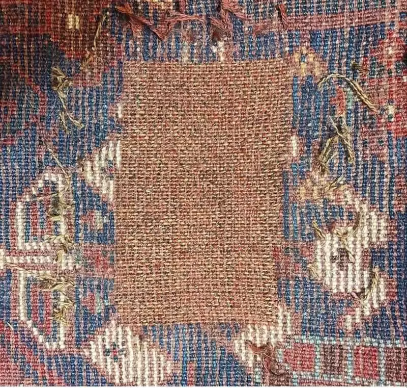  réparation de tapis persan ancien fortement endommagé ( avant )