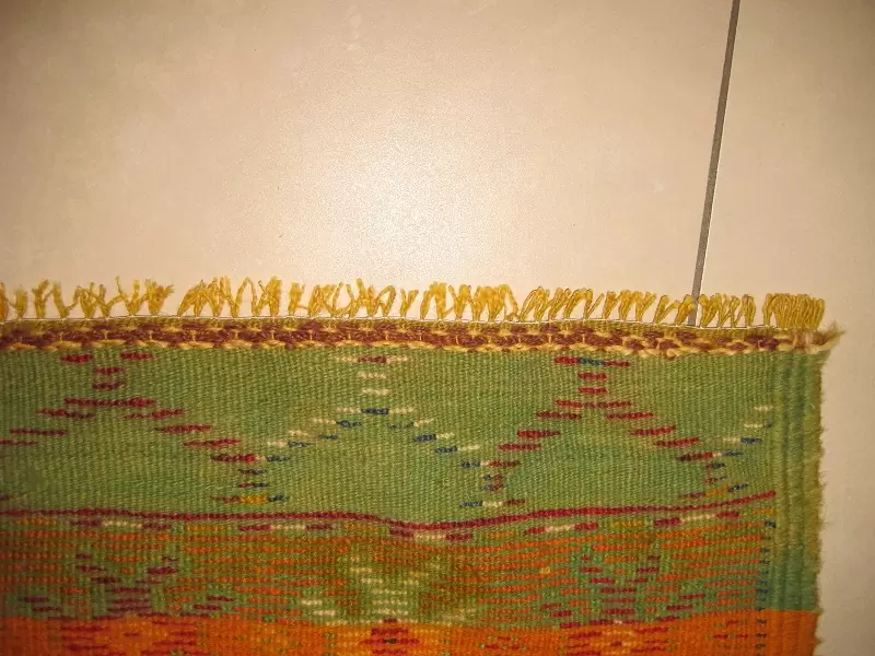 Restauration méticuleuse des franges de tapis ( après )